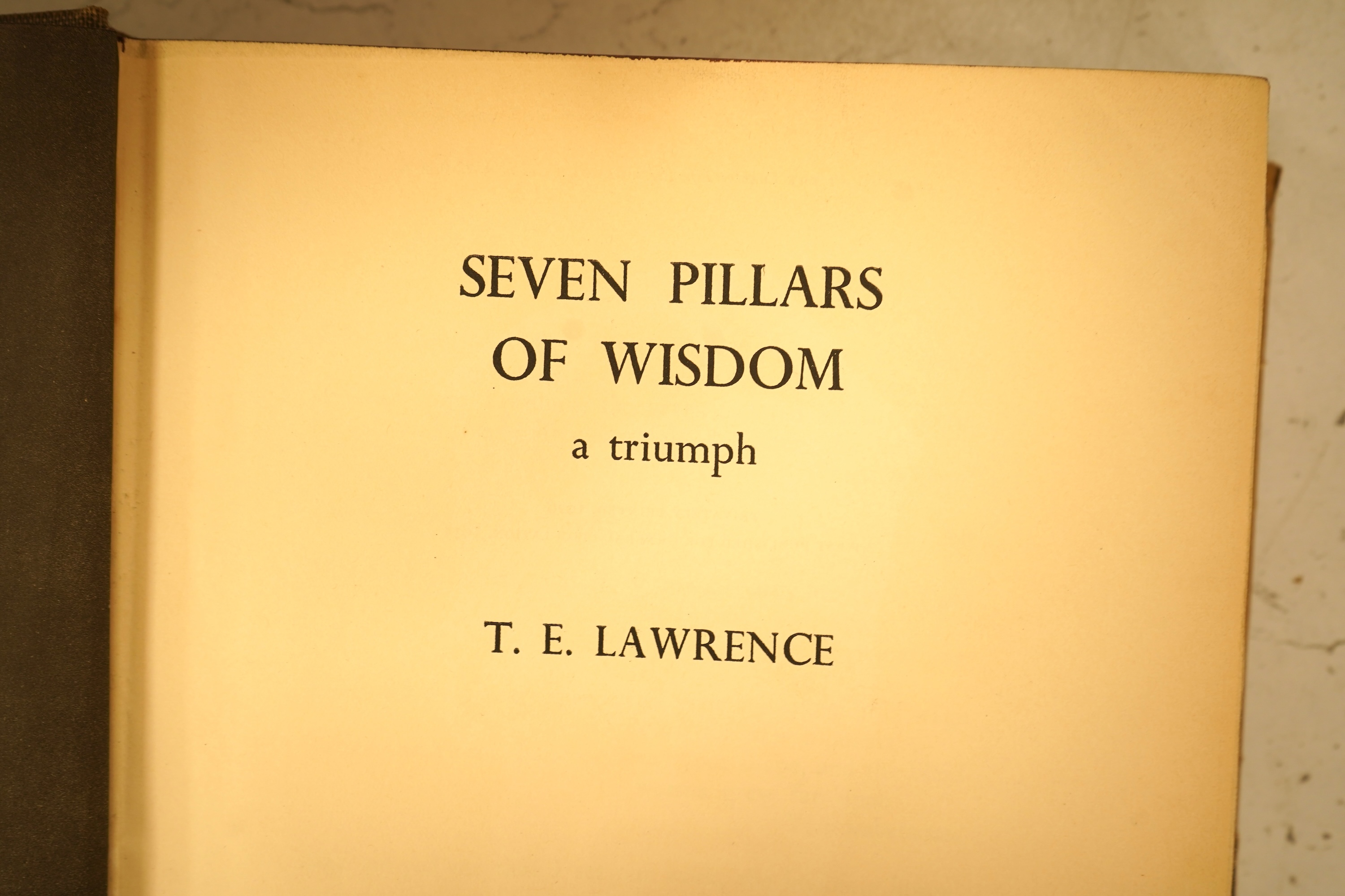 Lawrence, T.E. - Seven Pillars of Wisdom: a triumph. 1st US. trade edition. num. plates (many are portraits by Kennington and others), 6 text illus. and 4 maps (outline colour); publisher's gilt cloth and d/wrapper, roy.